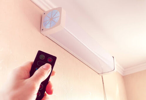 Hand clicking remote for air purifier